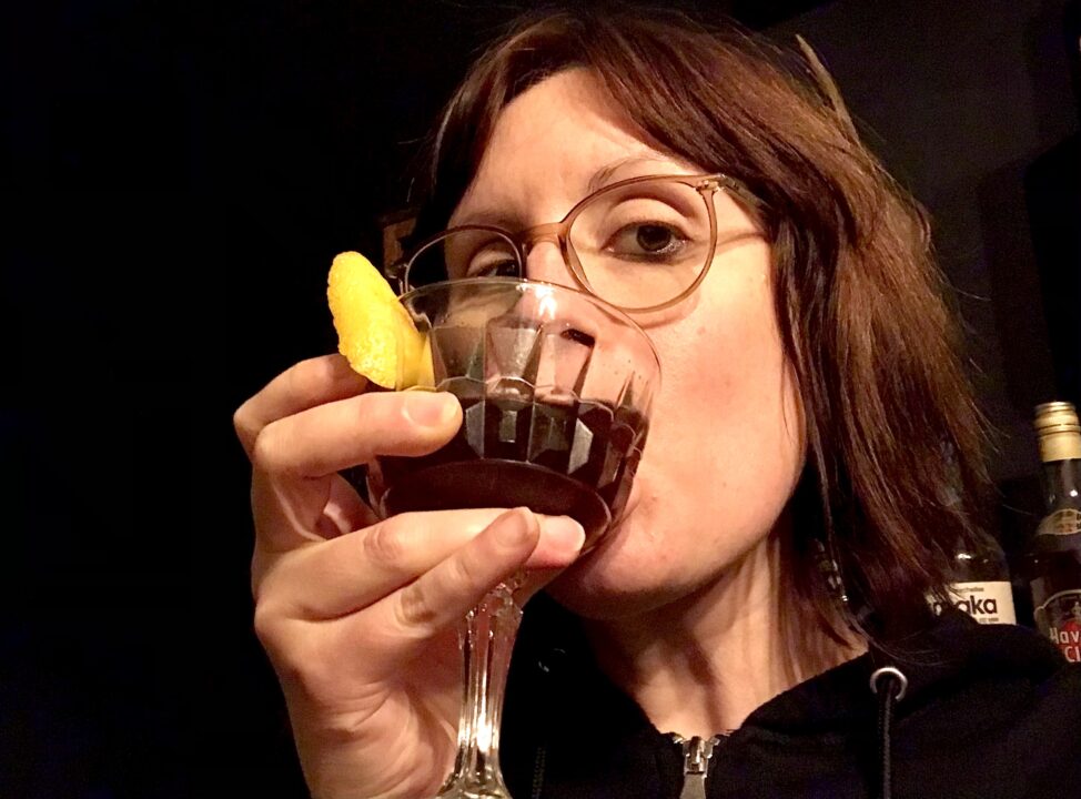 A selfie of Ava drinking a Vieux Carré